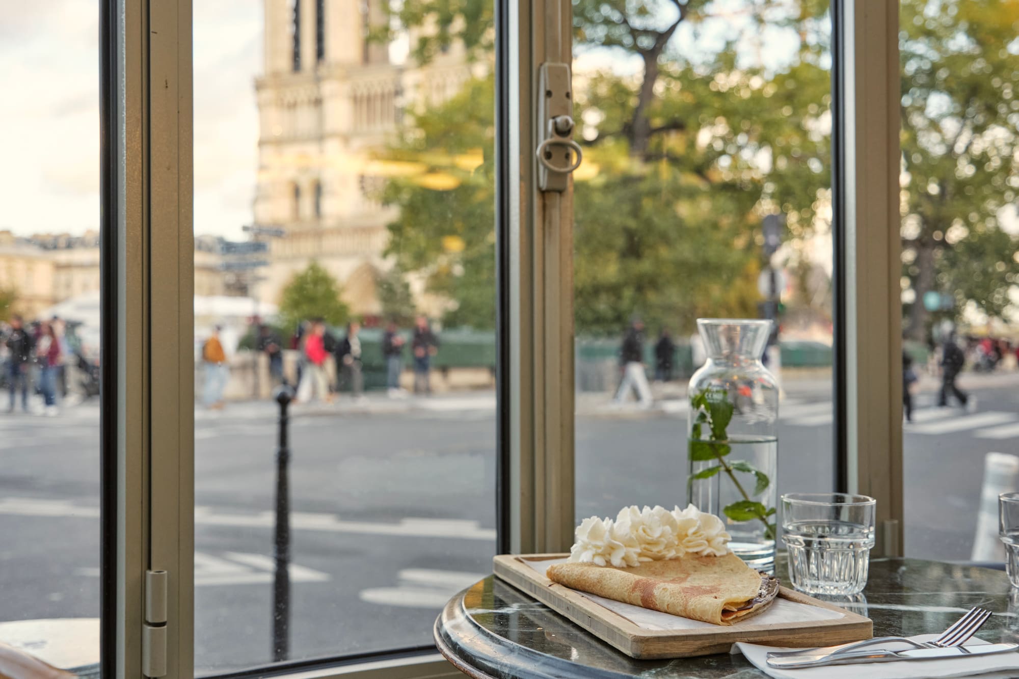 a table with food on it and a glass of water on it