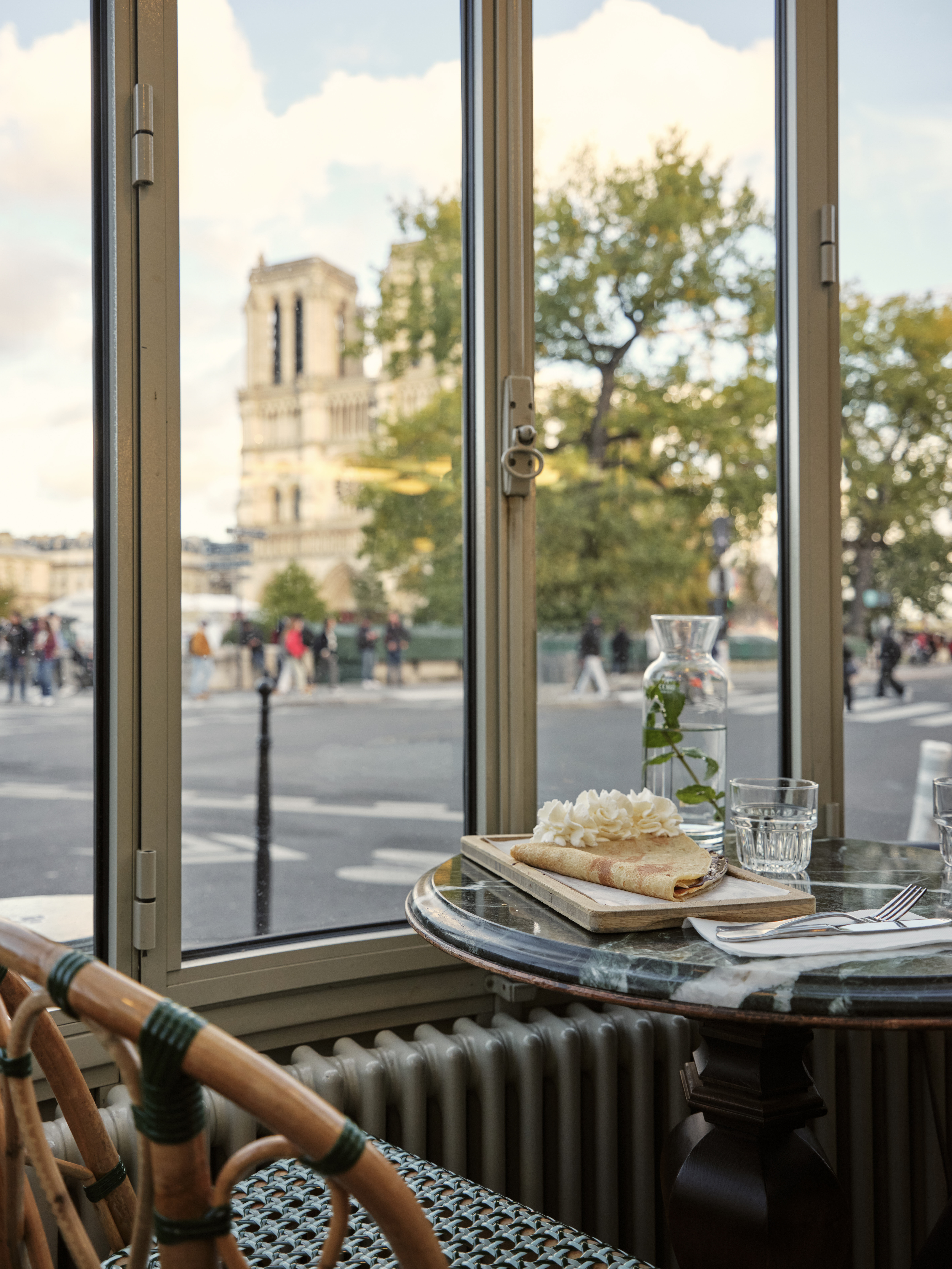 a table with food on it and a glass of water on it
