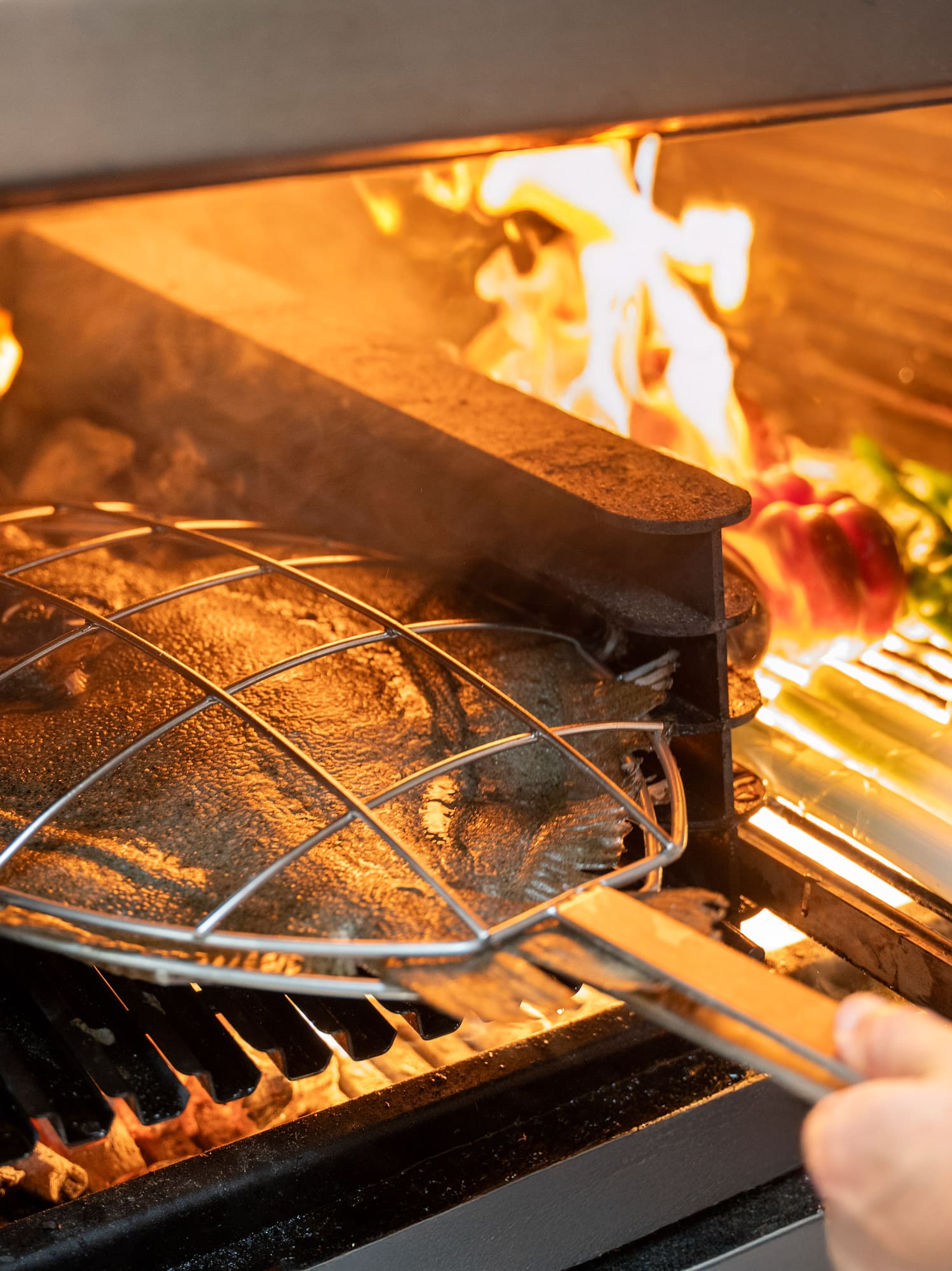 a person cooking food in an oven