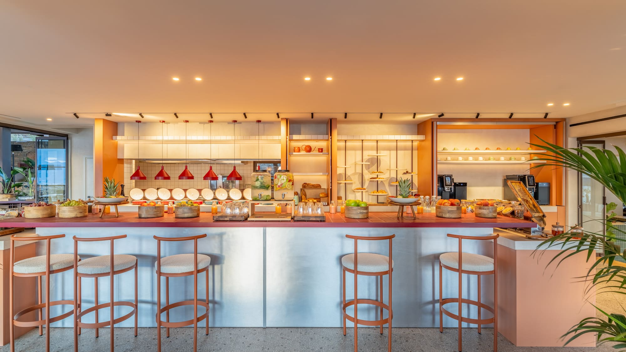 a kitchen with a counter and stools