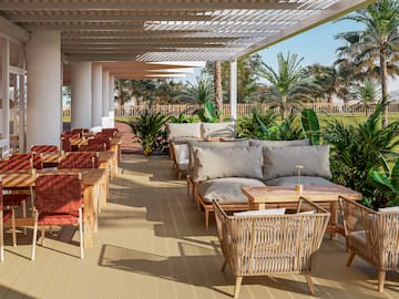 a patio with chairs and tables