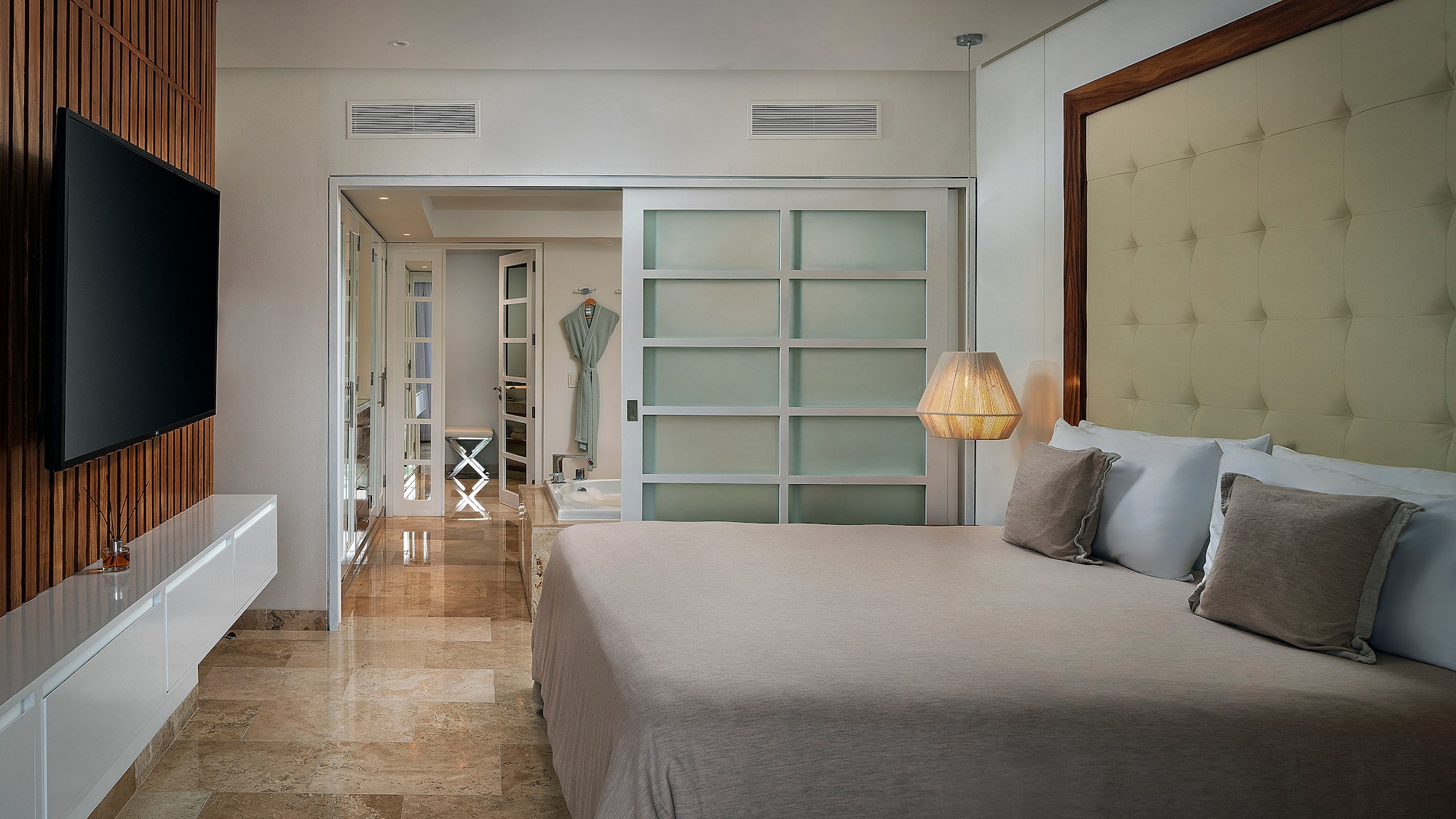 a bedroom with a bed and a mirror