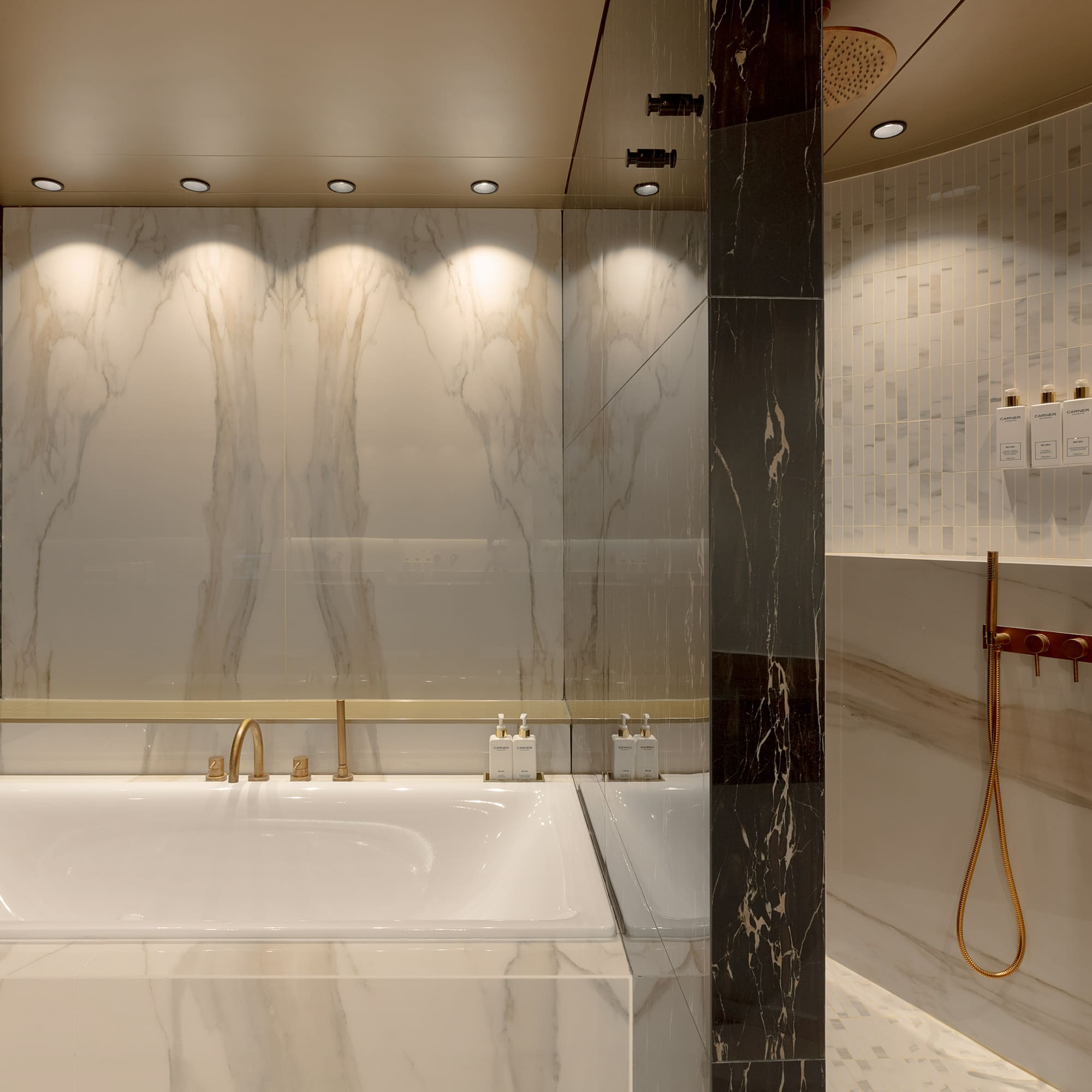 a bathroom with a tub and shower