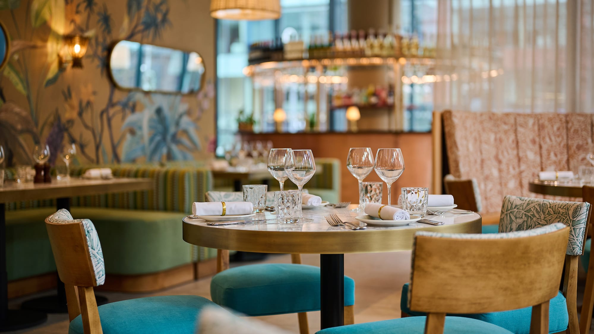 a table with glasses and napkins in a restaurant