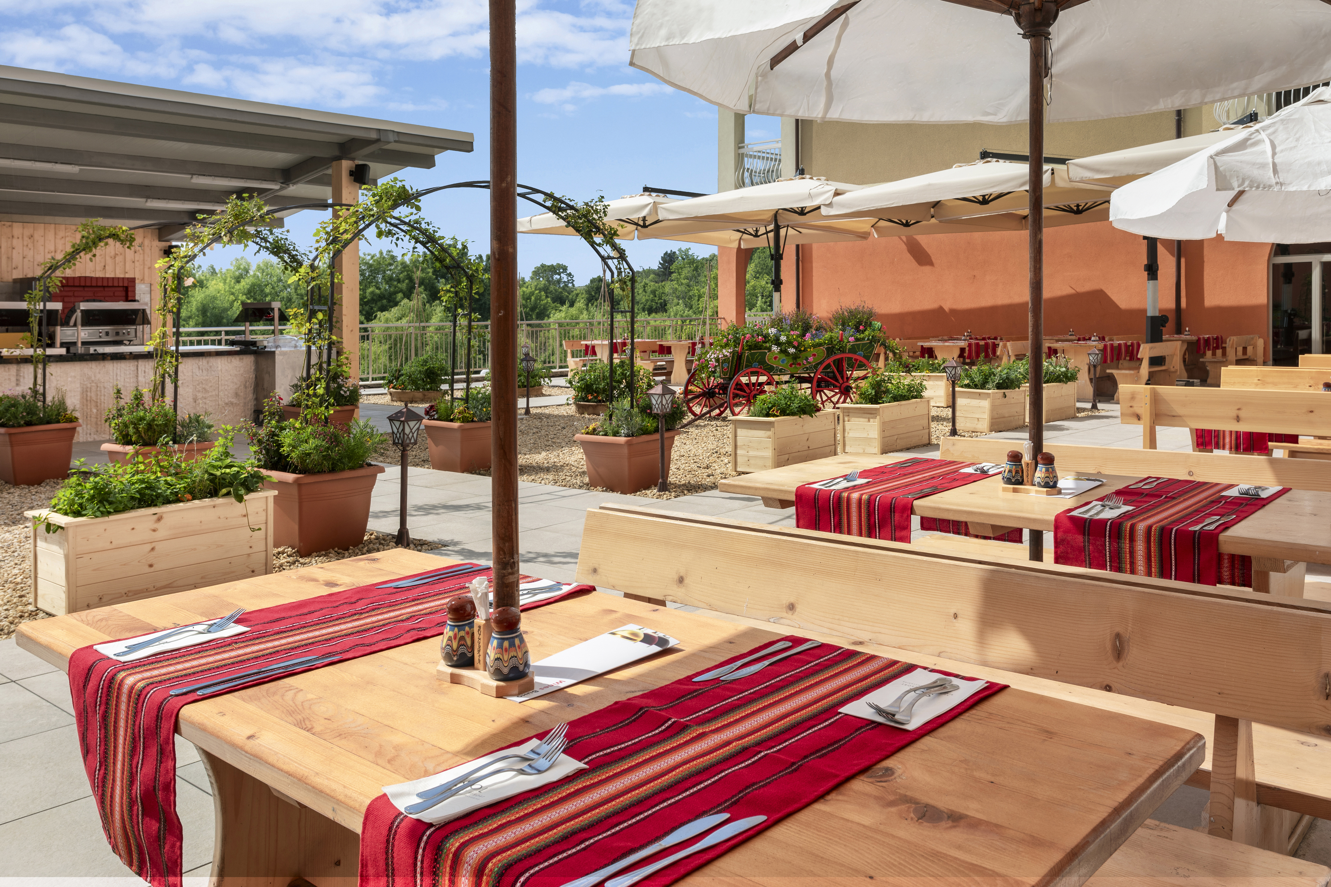 a table with red cloth and white umbrellas