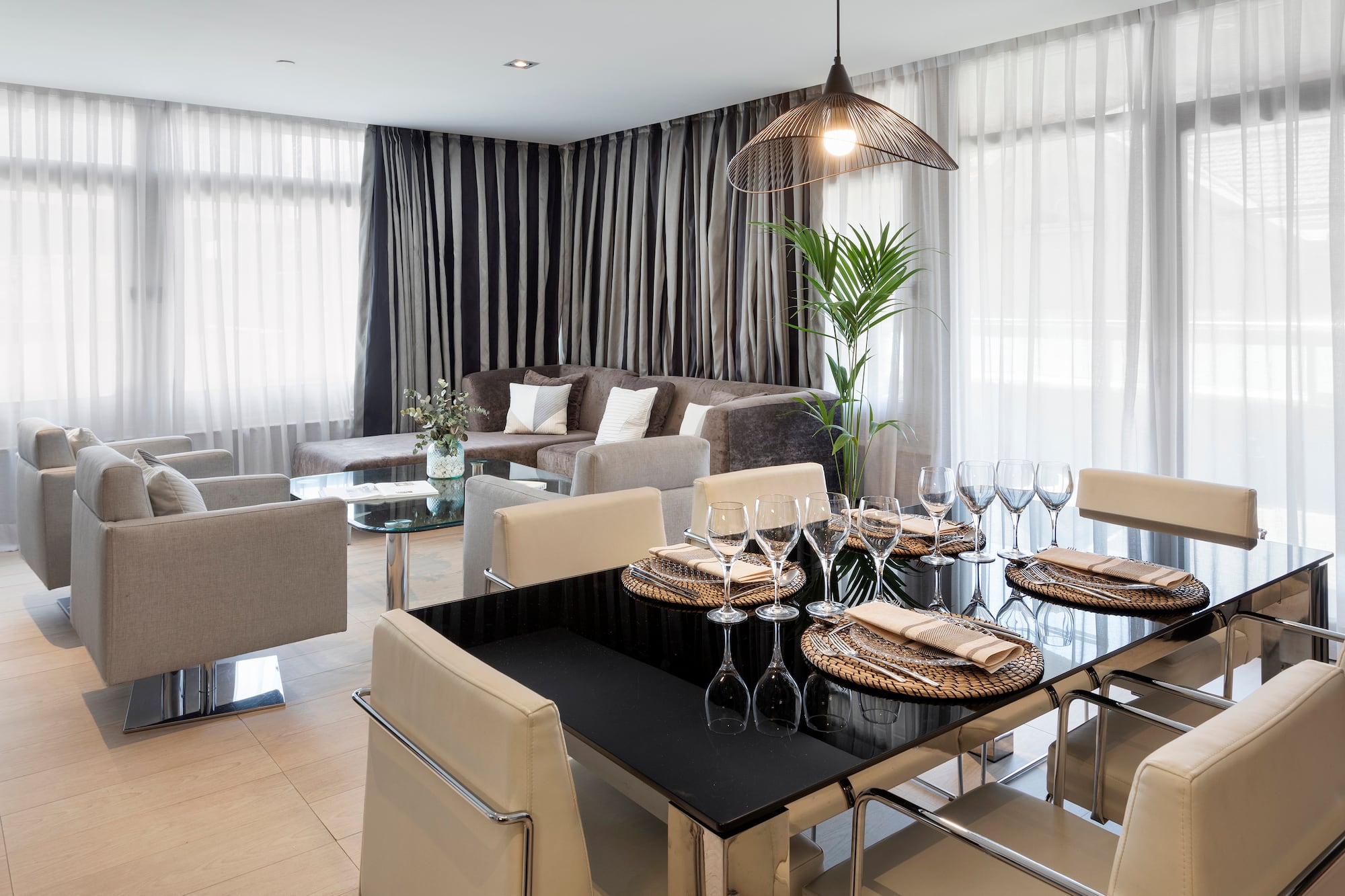 a dining room with a table and chairs