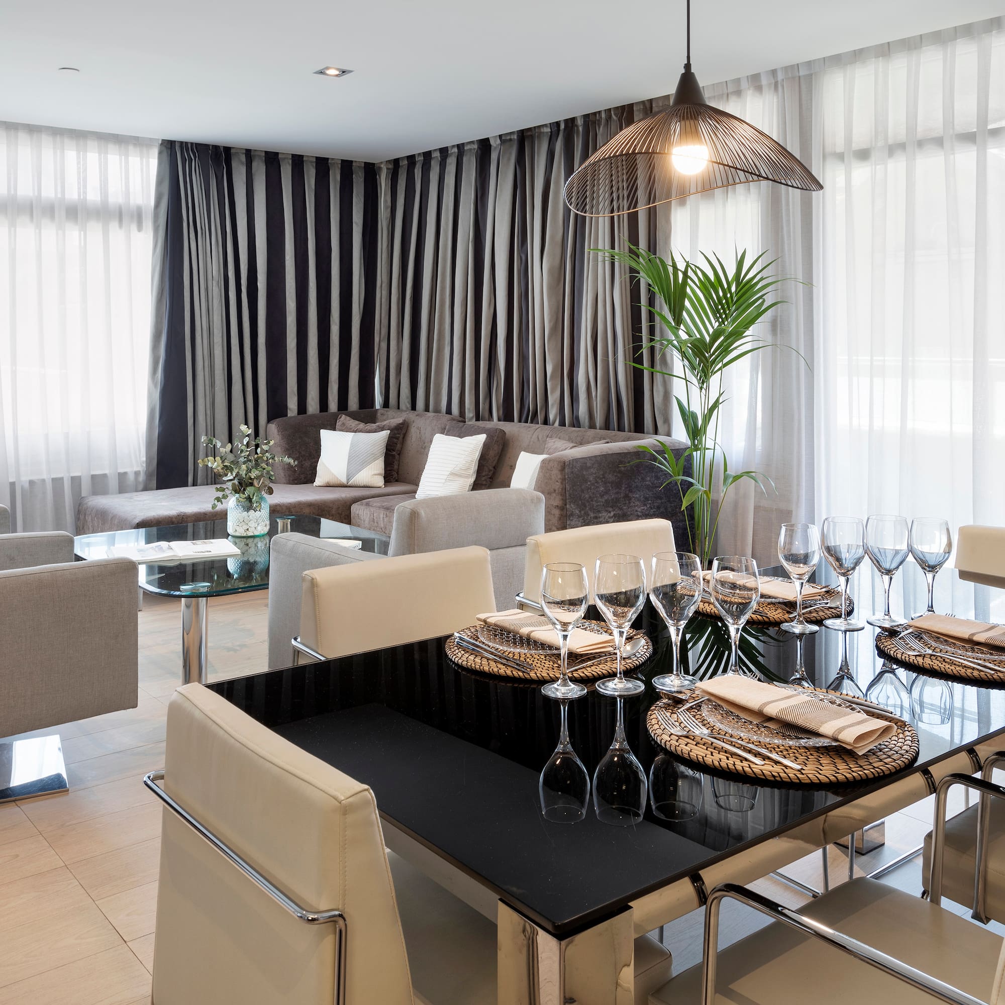 a dining room with a table and chairs