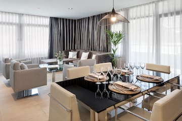 a dining room with a table and chairs