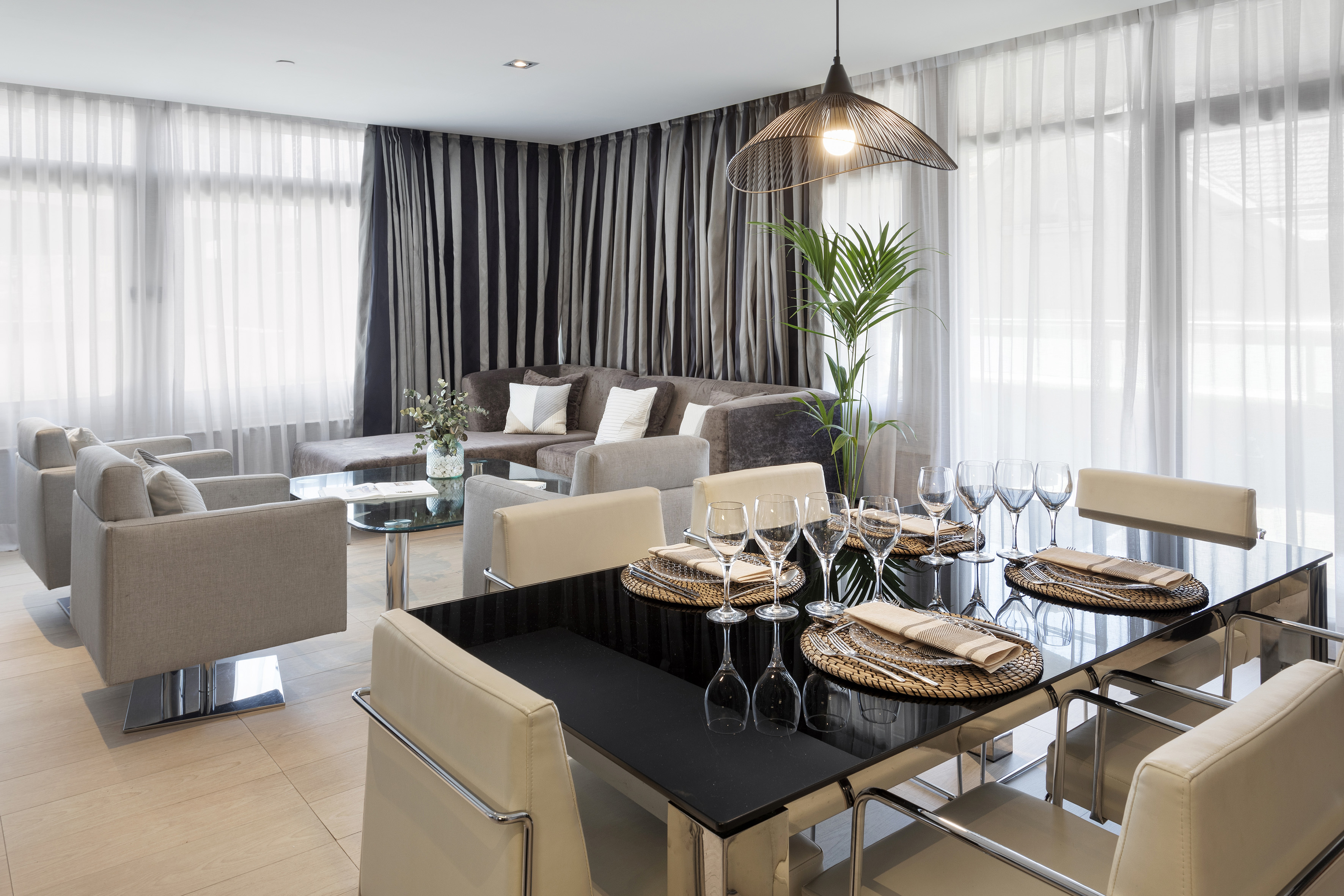 a dining room with a table and chairs