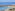 Aerial view of Los Cristianos Beach, harbor with boats, and coastal town.