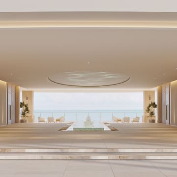 a large room with a fountain and a pool