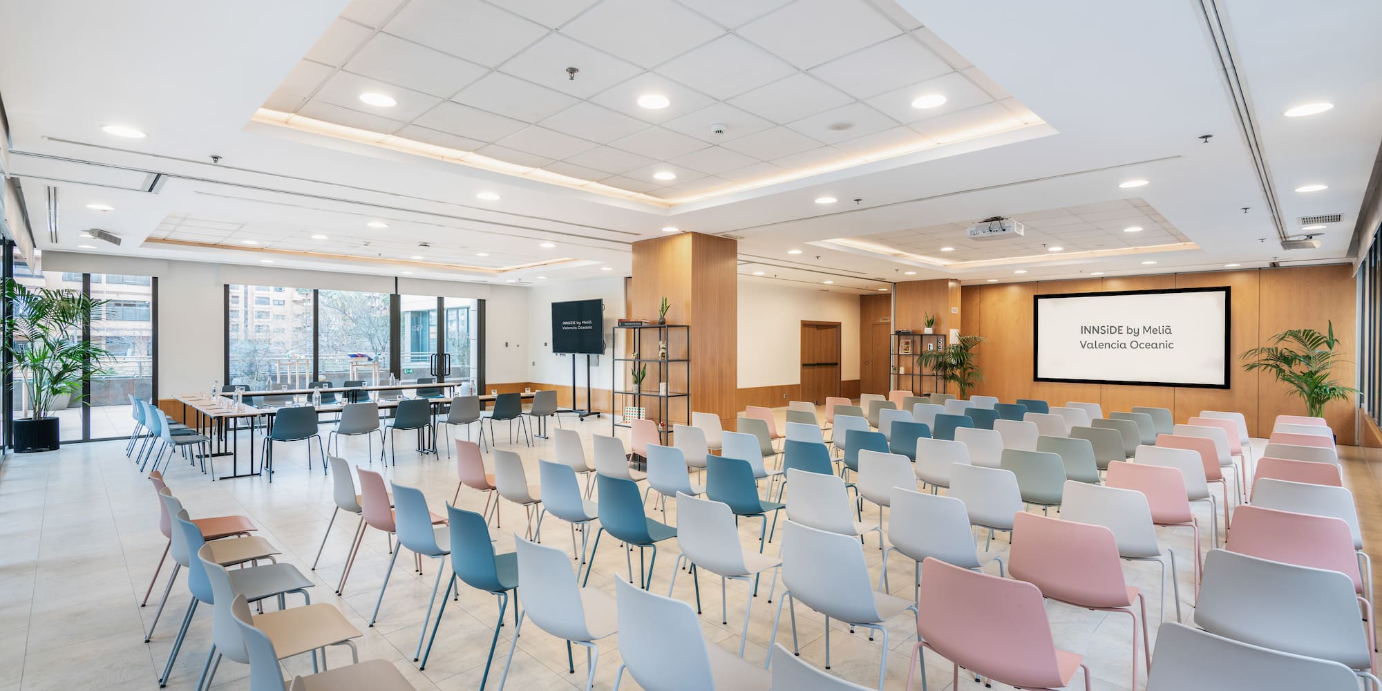 a room with many chairs and tables