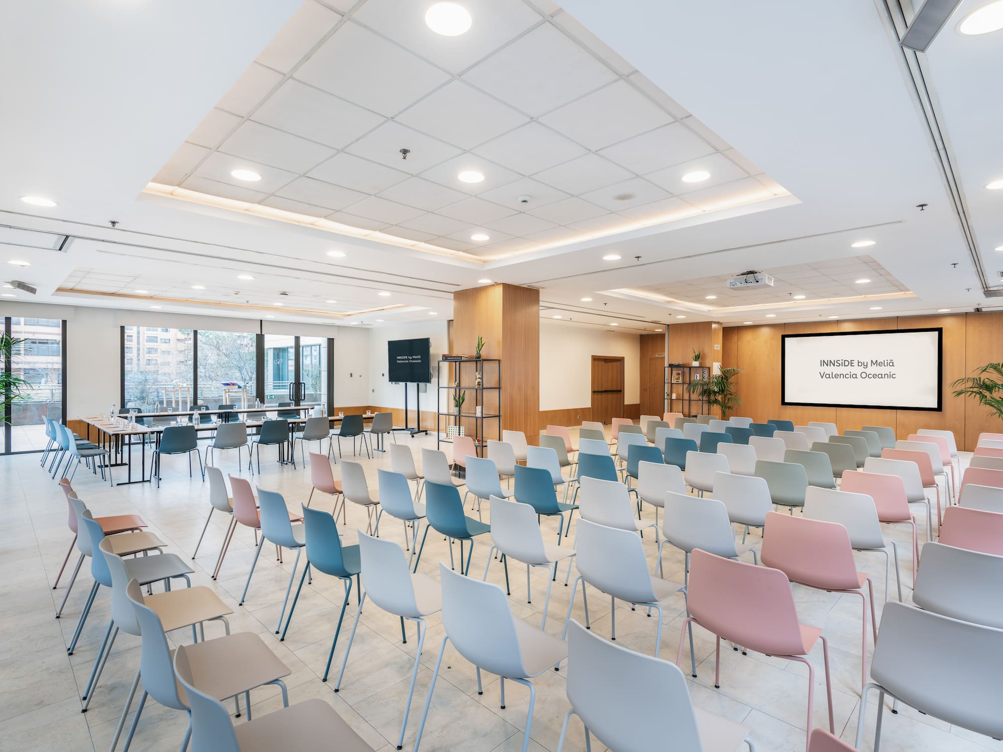 a room with many chairs and tables
