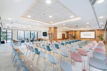 a room with many chairs and tables