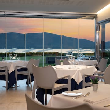 a restaurant with tables and chairs