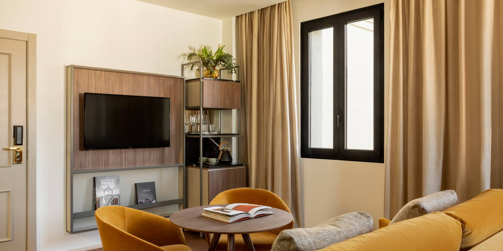 a living room with a tv and a table