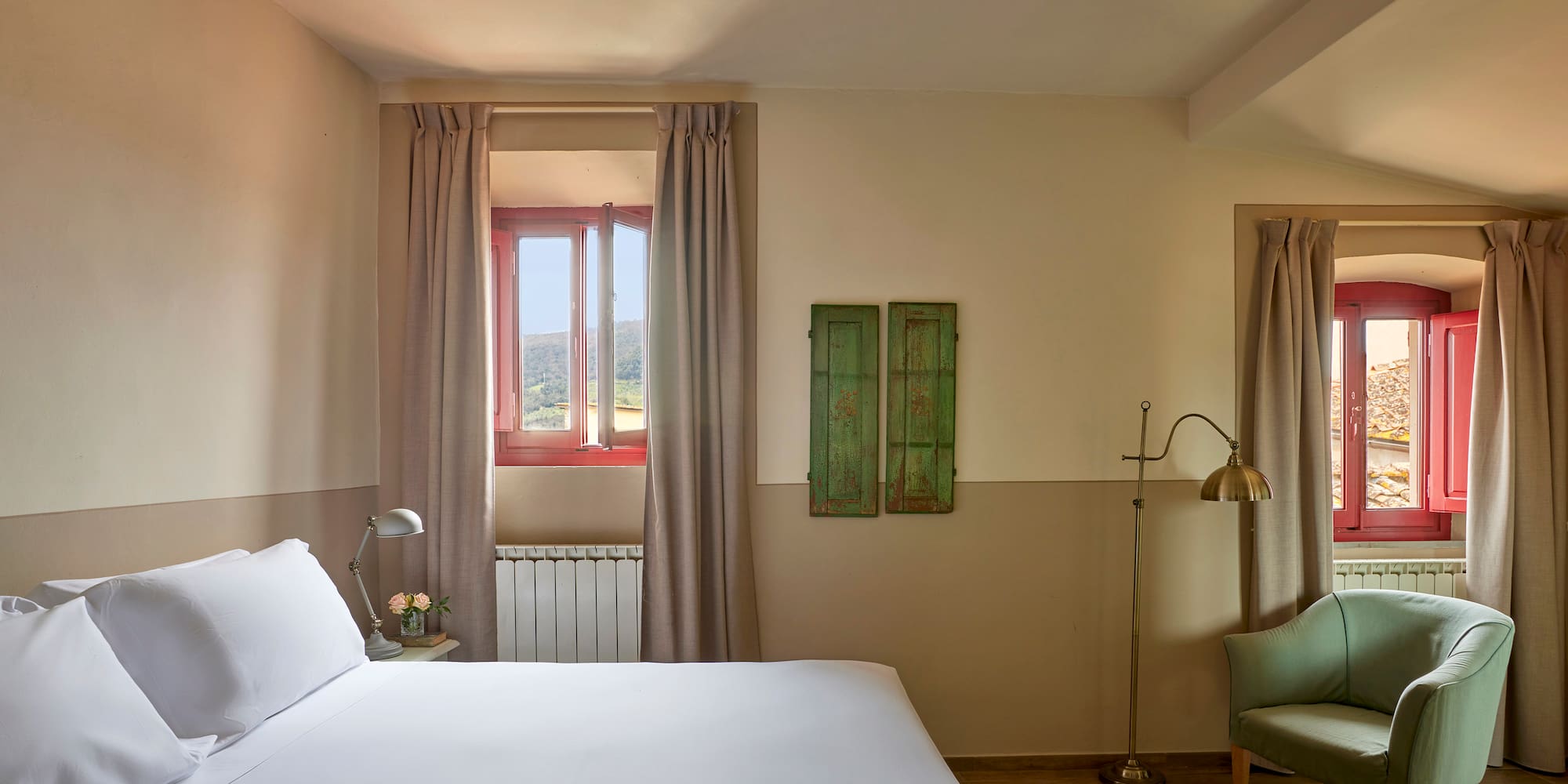 a bedroom with a bed and a chair