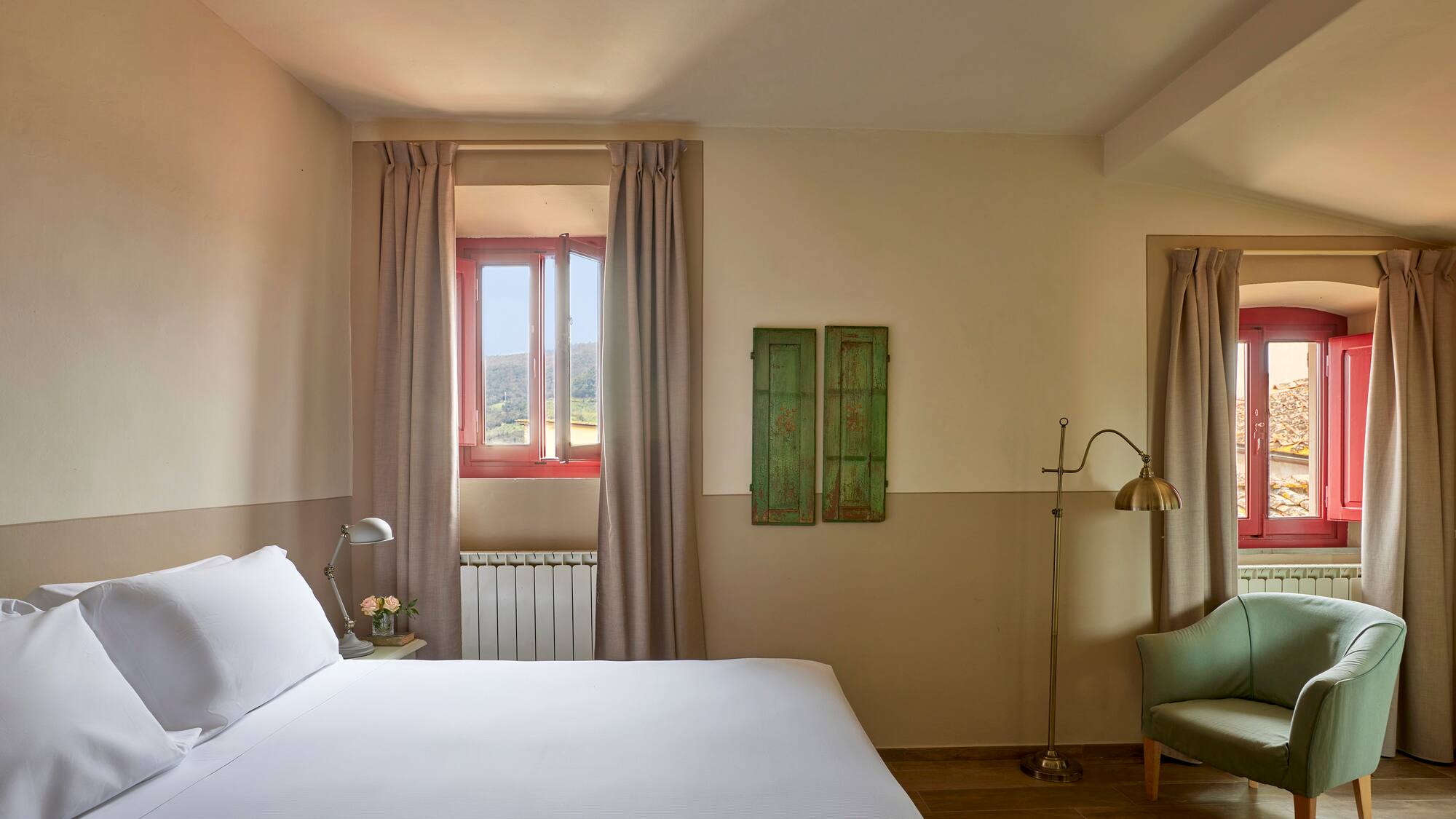 a bedroom with a bed and a chair