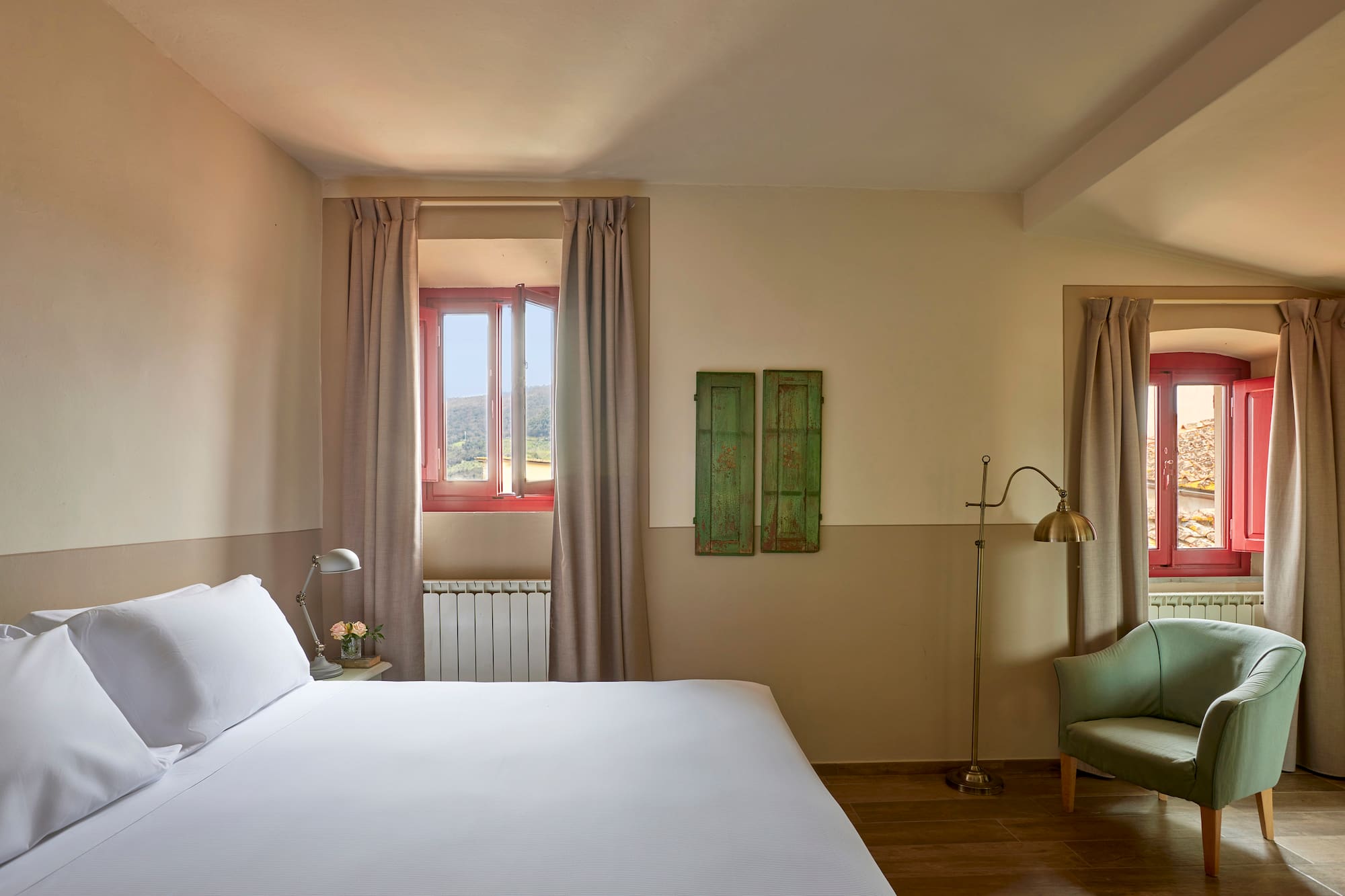 a bedroom with a bed and a chair