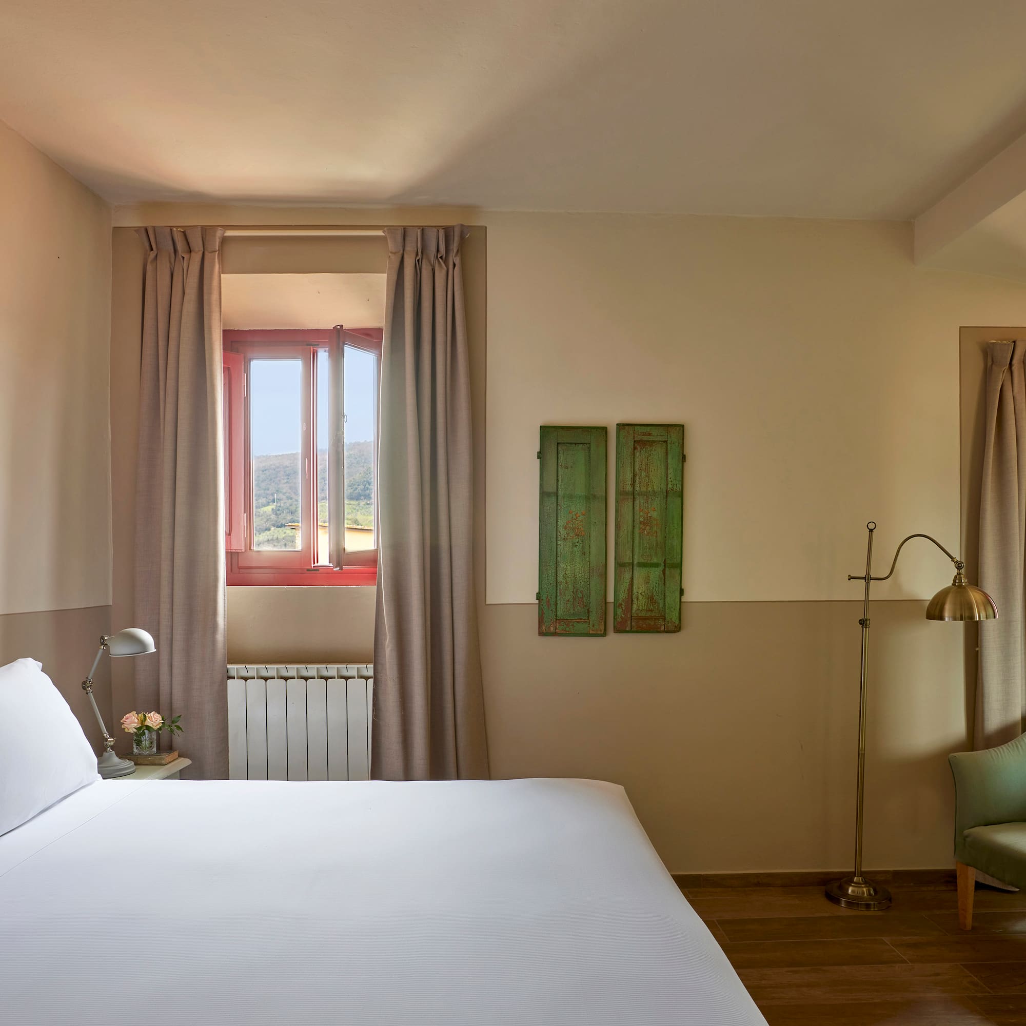 a bedroom with a bed and a chair