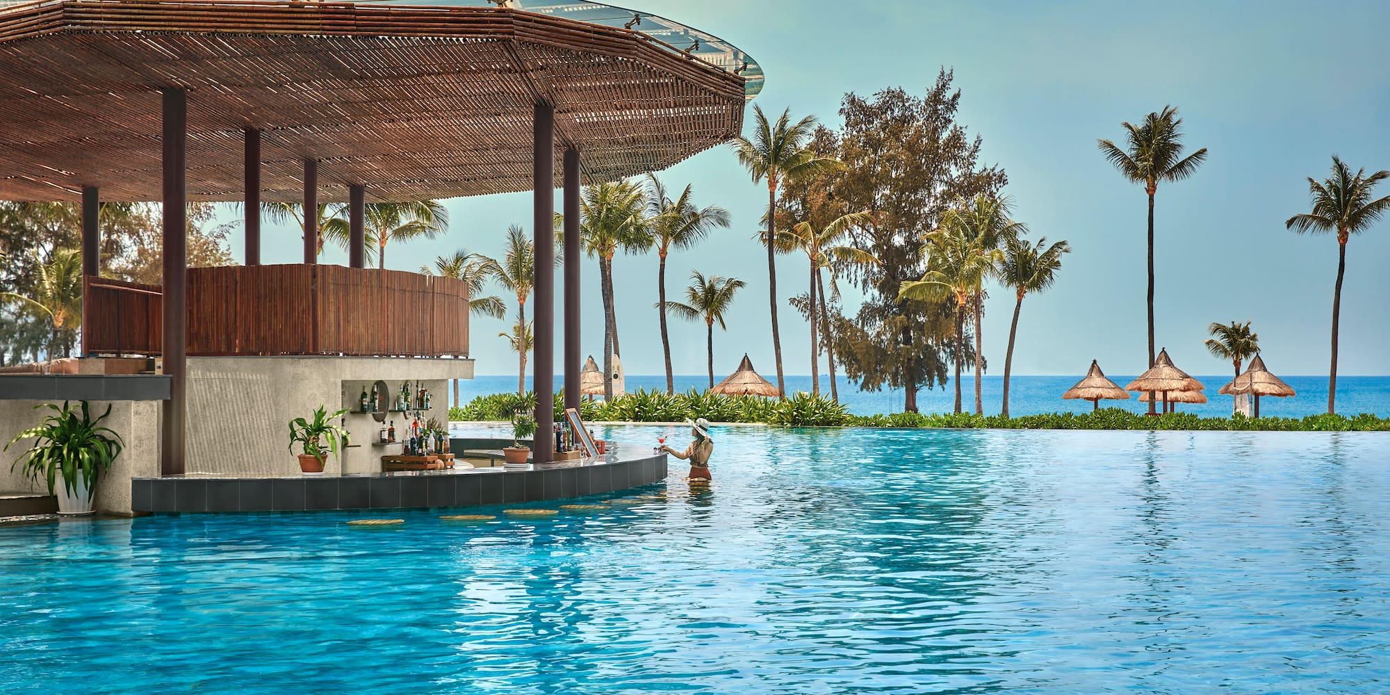 a pool with a bar and a bar on the side