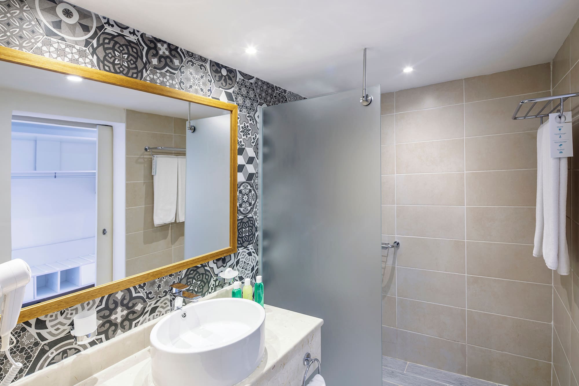 a bathroom with a mirror and sink