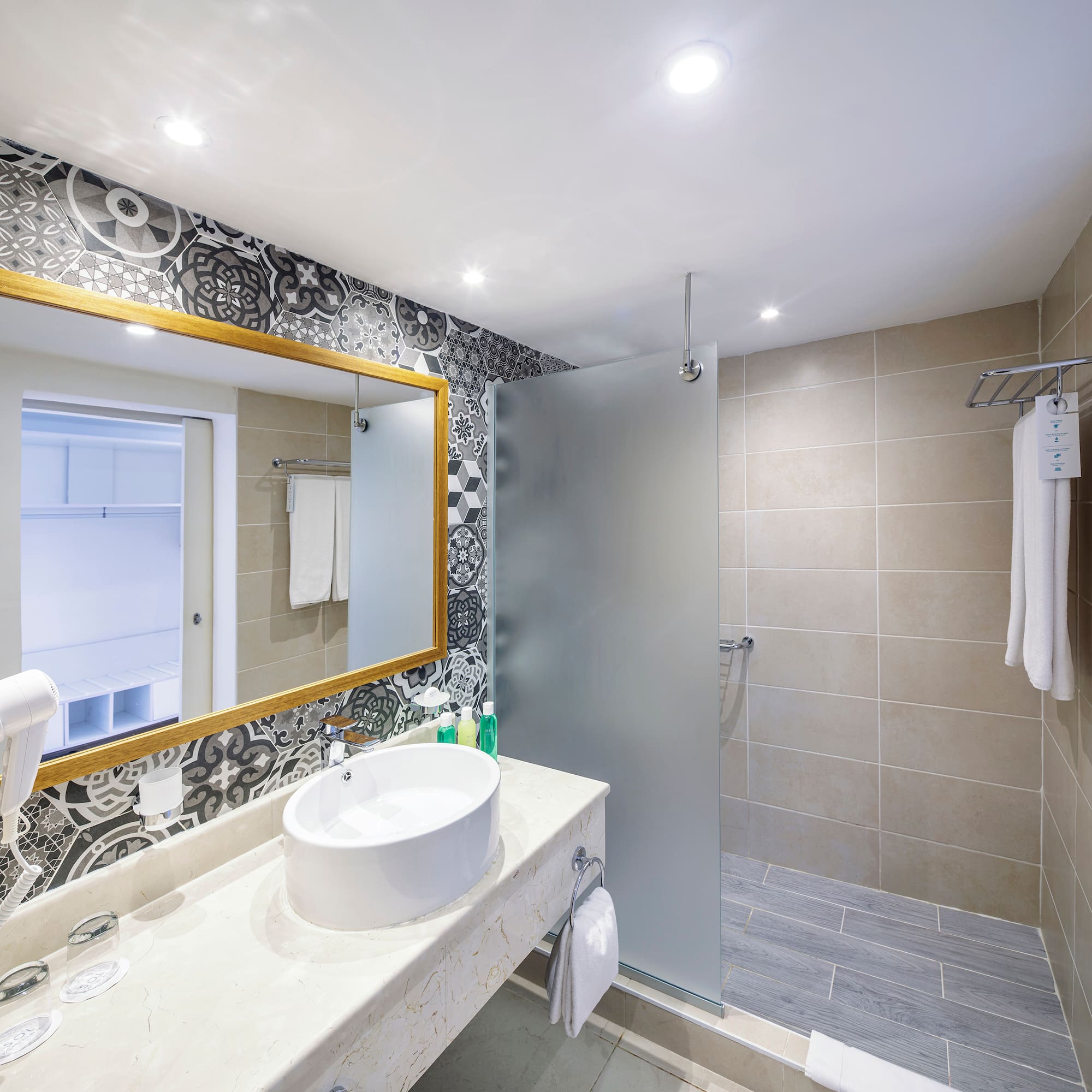 a bathroom with a mirror and sink