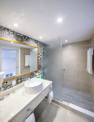 a bathroom with a mirror and sink