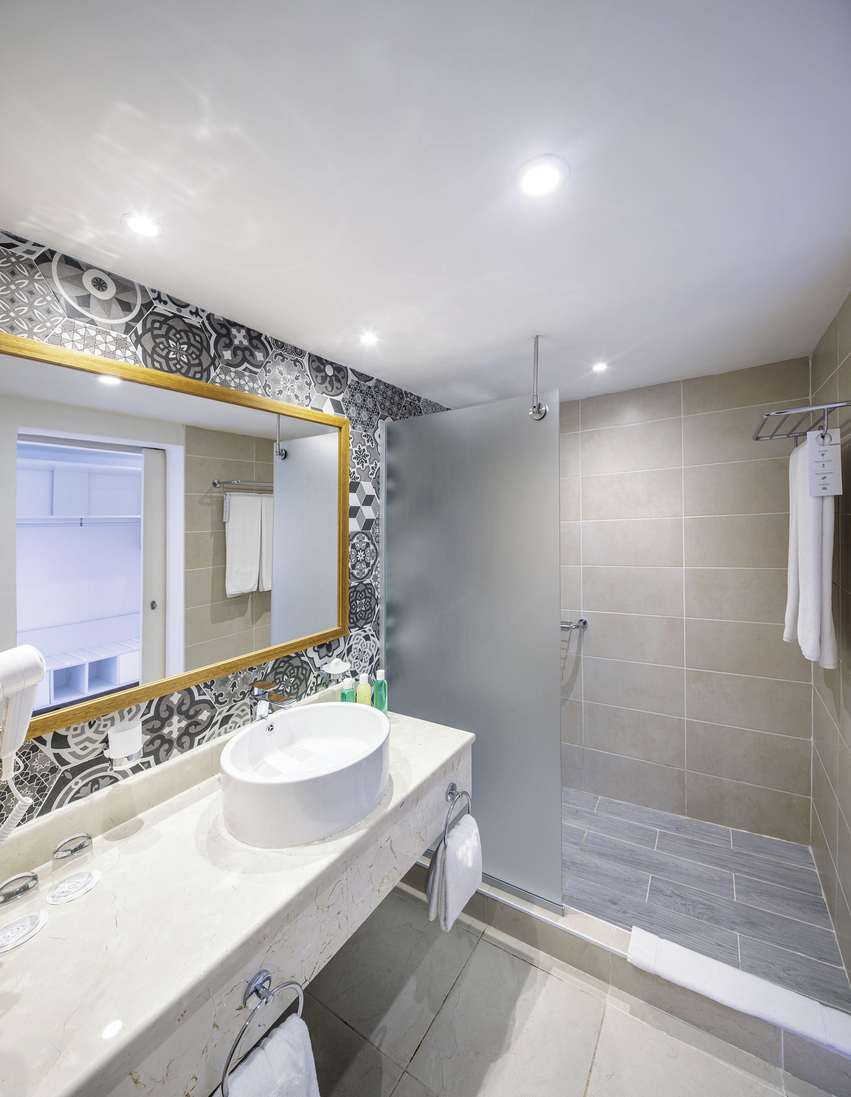 a bathroom with a mirror and sink