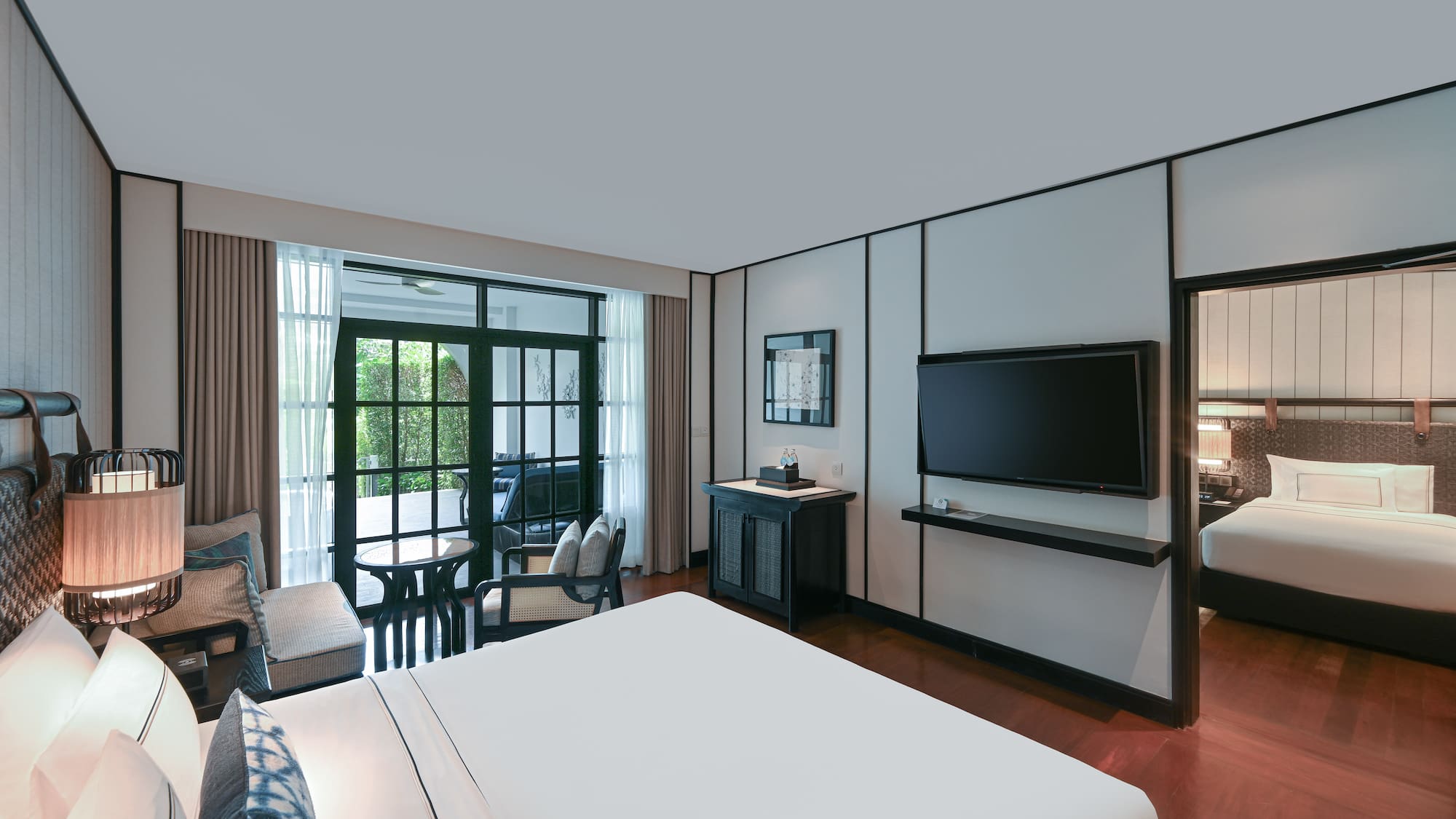 a room with a bed and a television