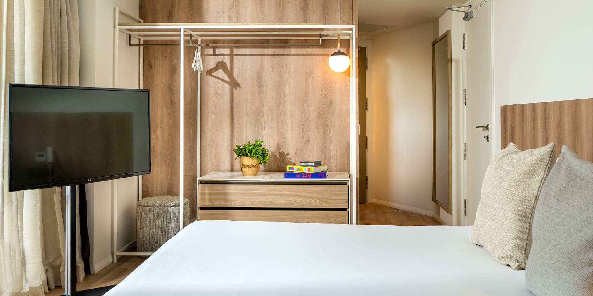 a room with a bed and a tv