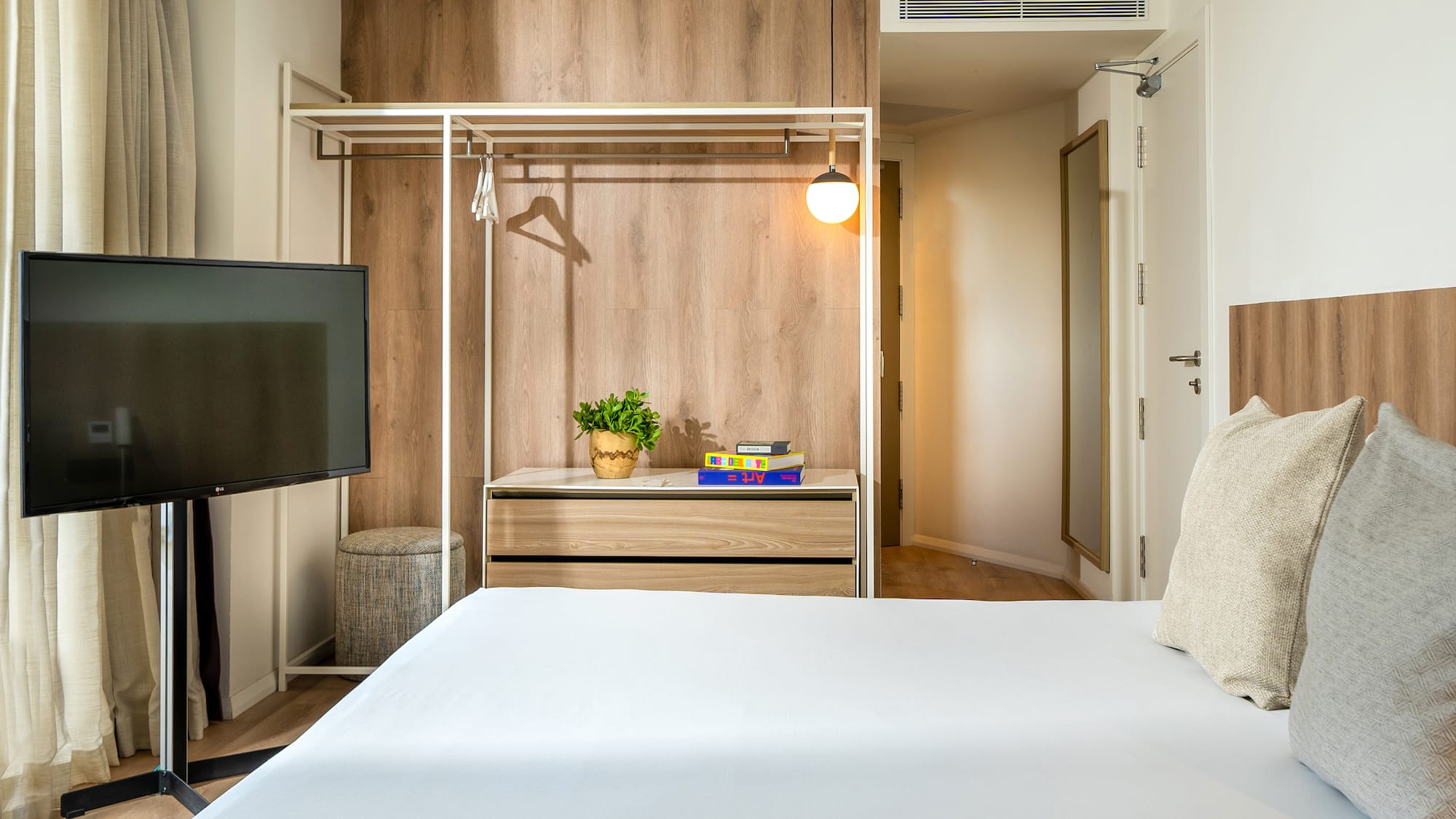 a room with a bed and a tv