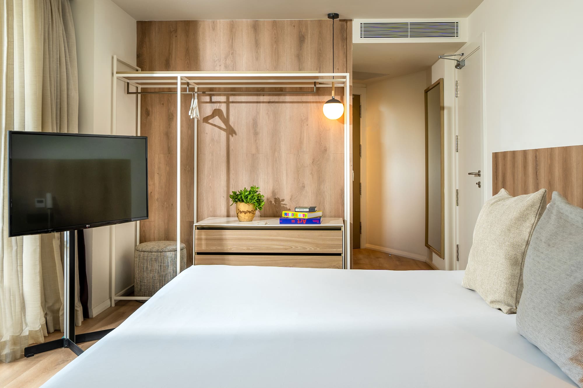 a room with a bed and a tv