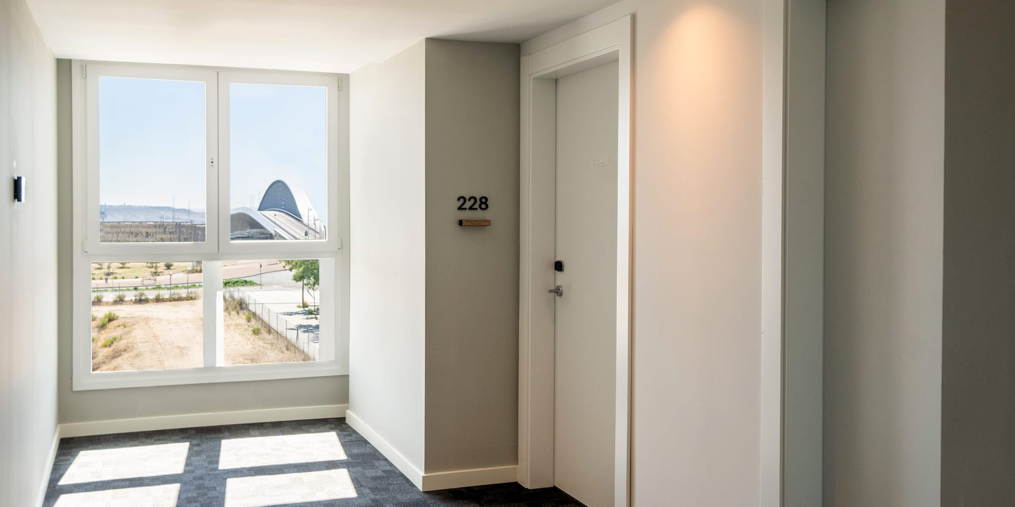 a room with two doors and a window