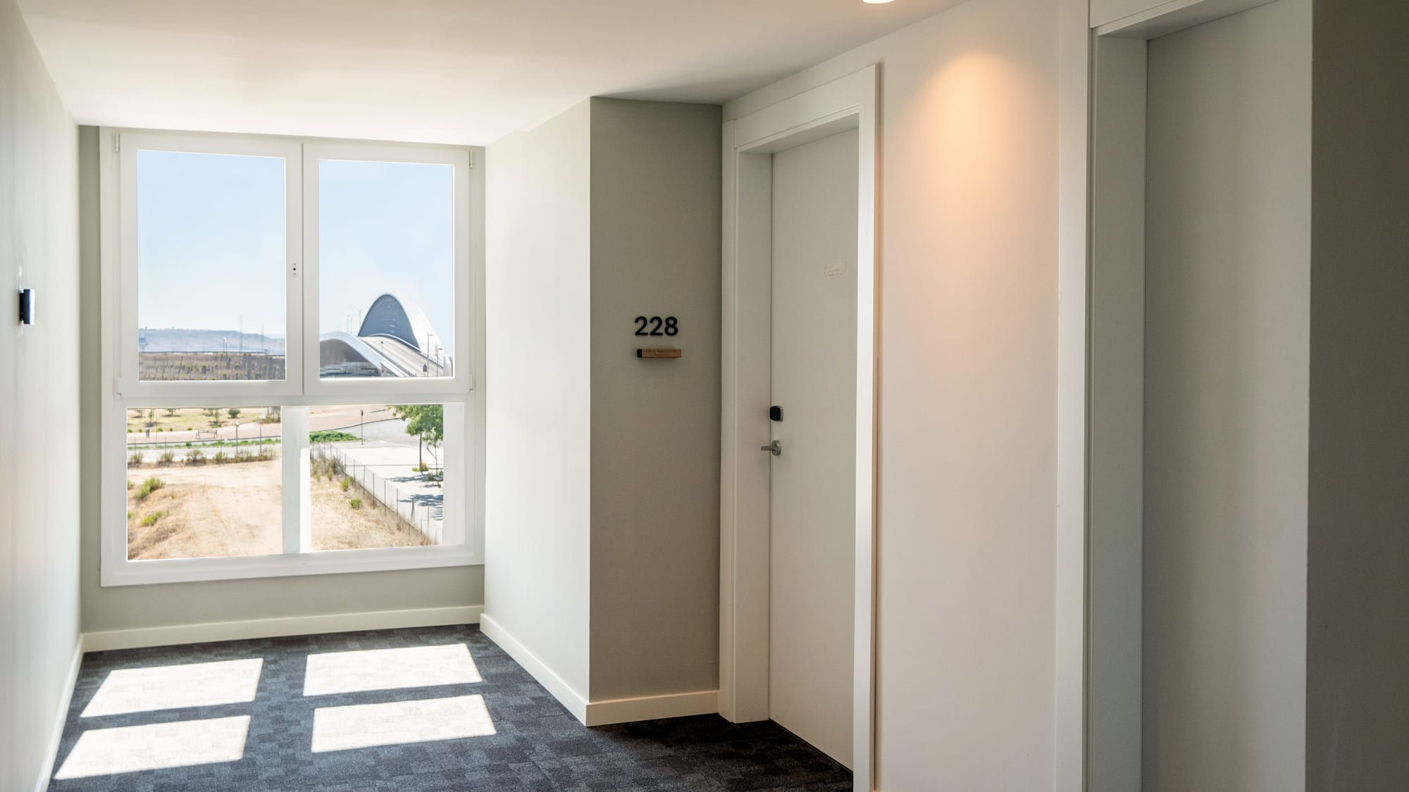 a room with two doors and a window