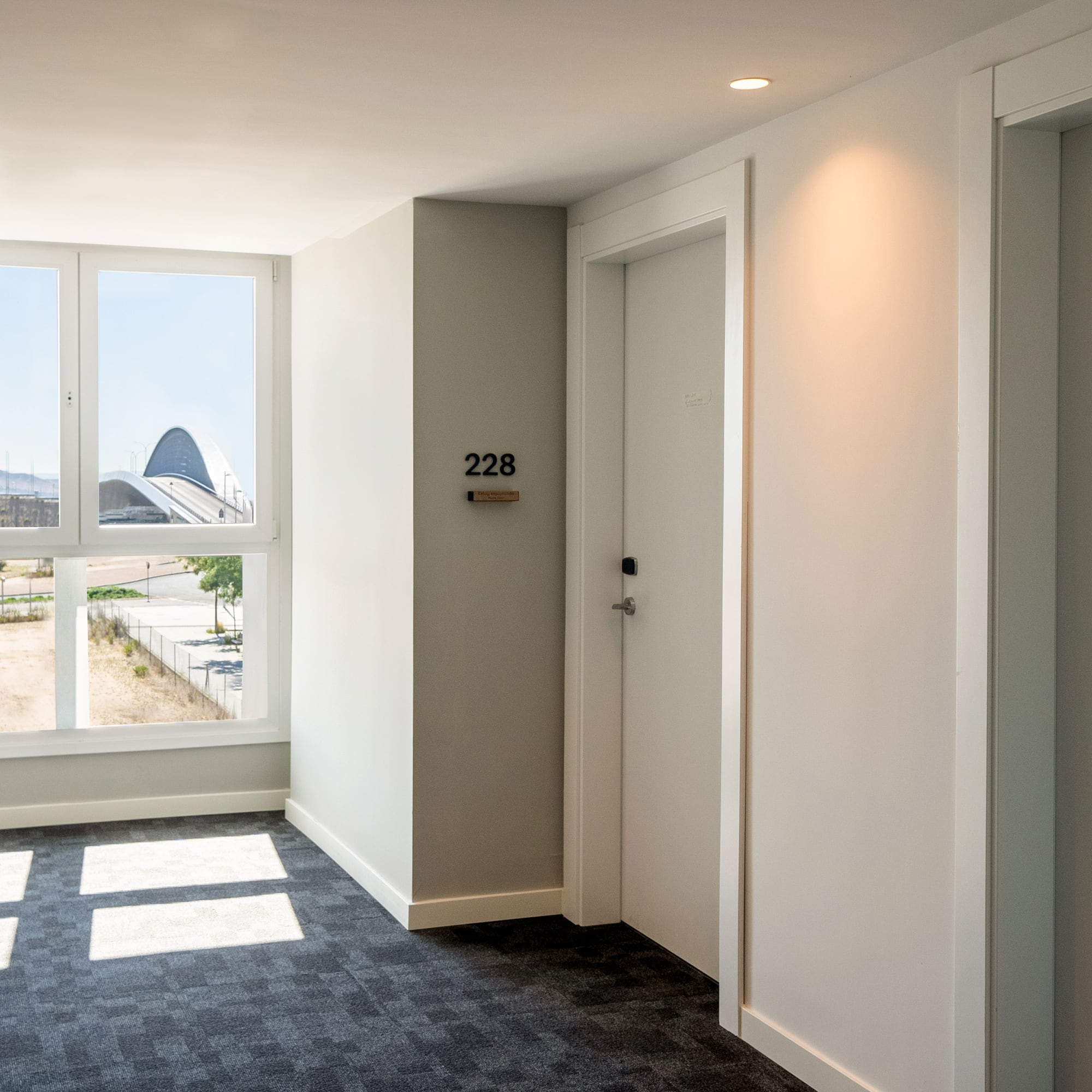 a room with two doors and a window