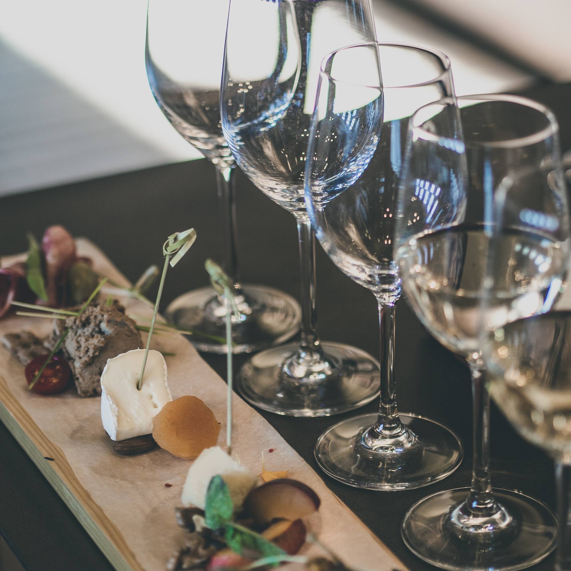 a group of wine glasses on a table