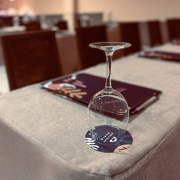 a wine glass on a table