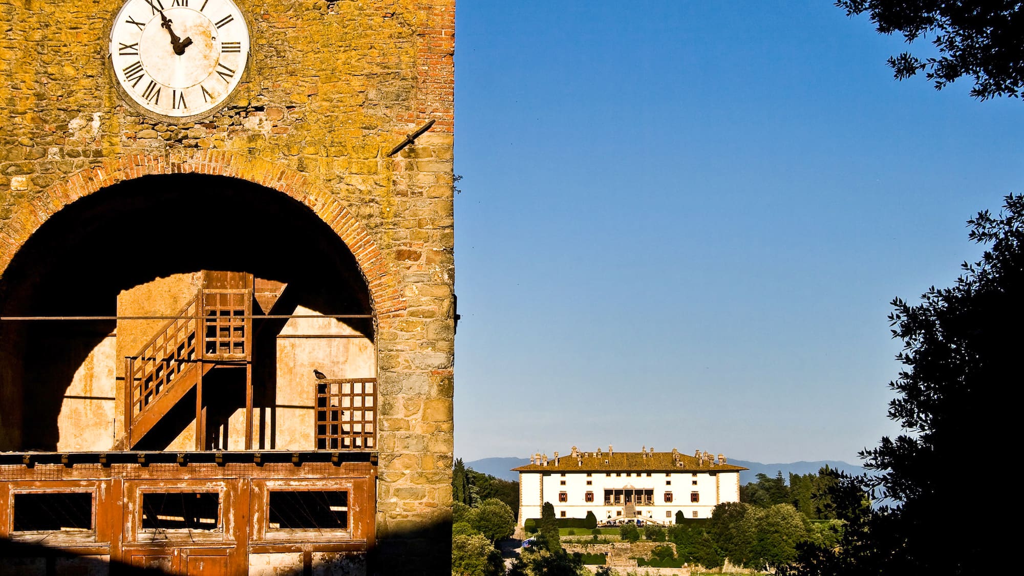 a clock on a brick tower