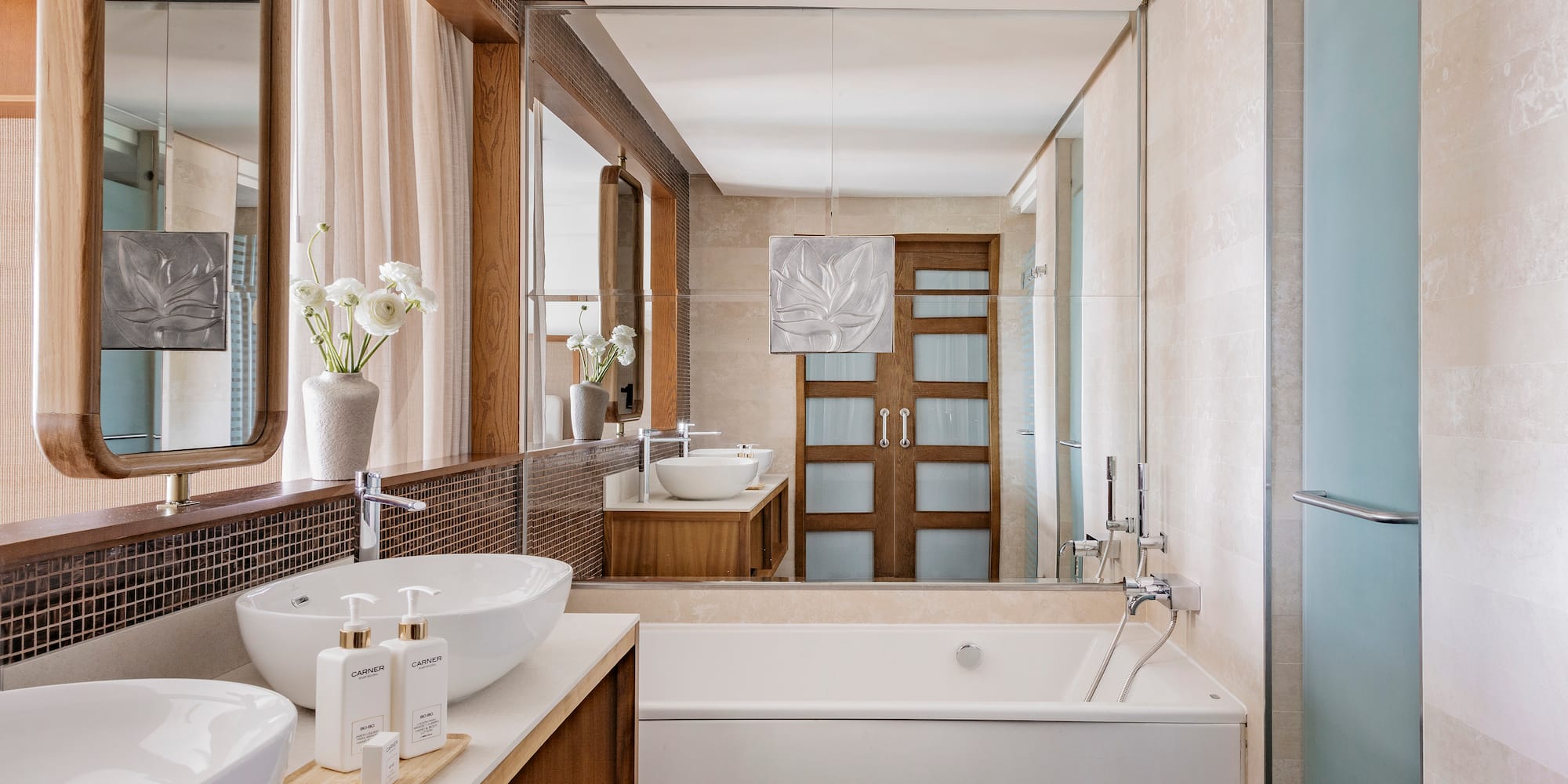 a bathroom with a tub and sink