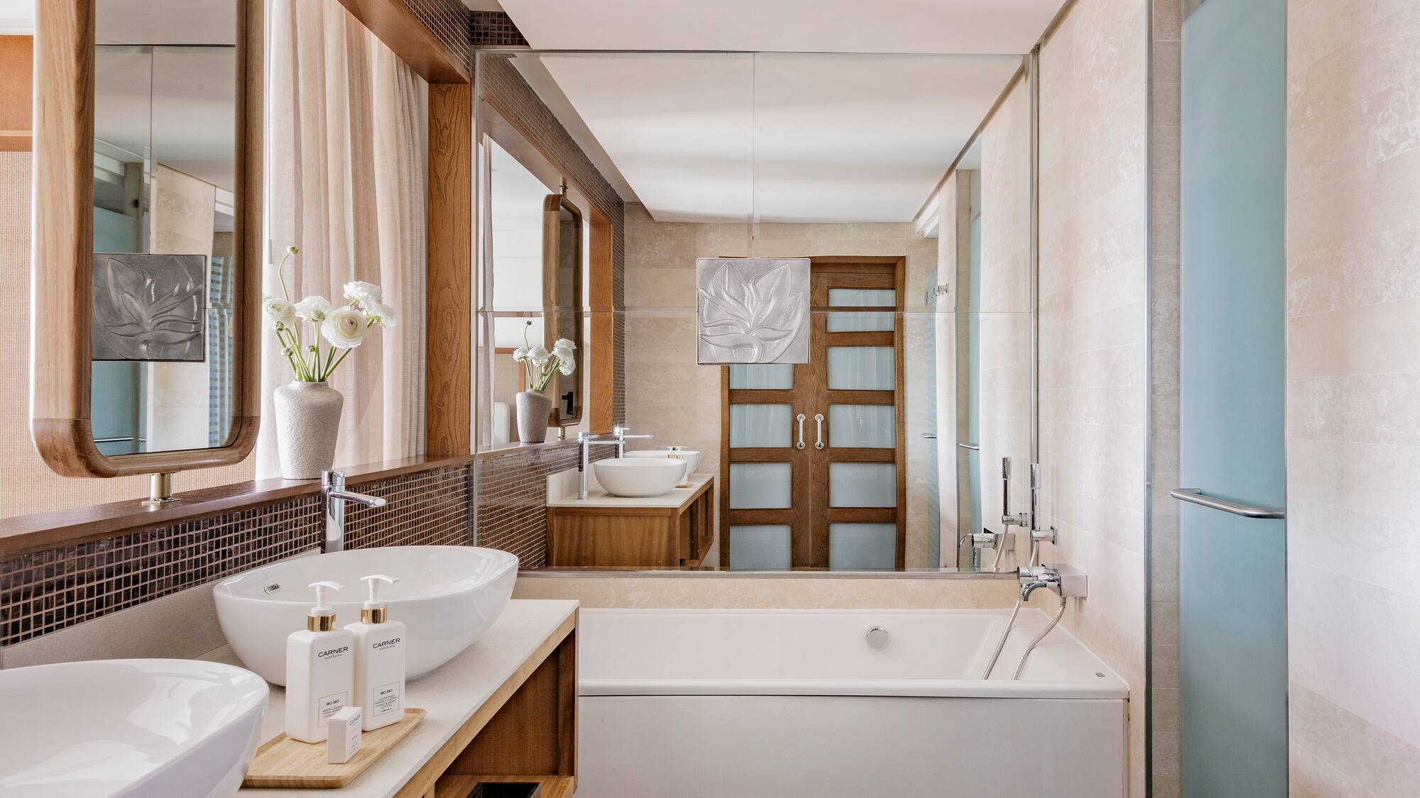 a bathroom with a tub and sink