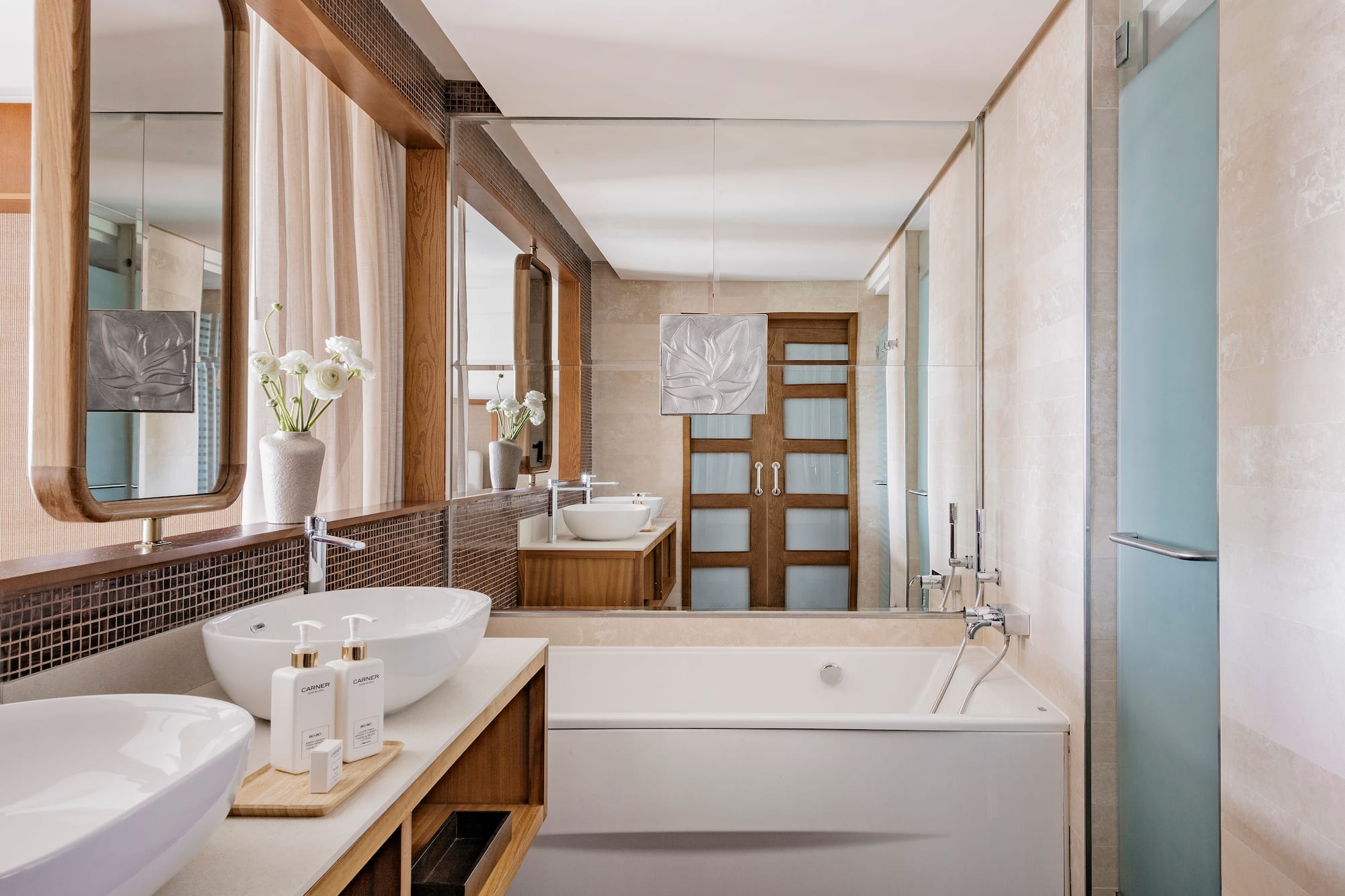 a bathroom with a tub and sink