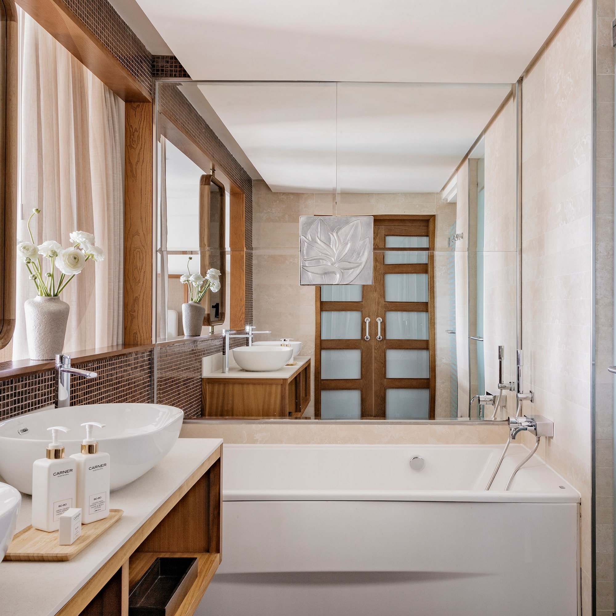 a bathroom with a tub and sink
