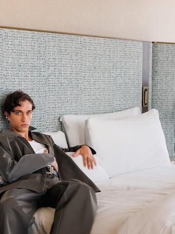 a man sitting on a bed