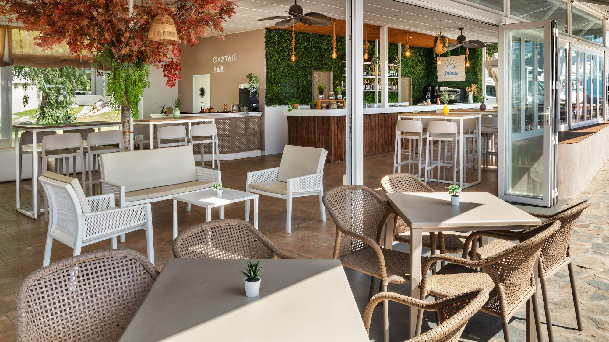 a patio with tables and chairs