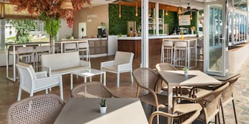 a patio with tables and chairs