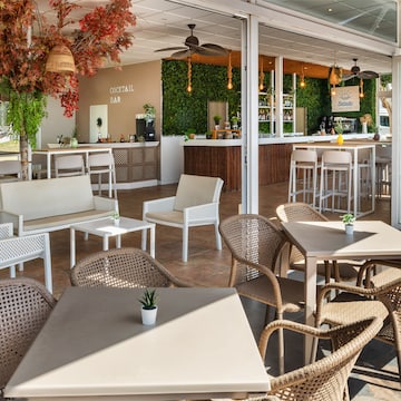 a patio with tables and chairs