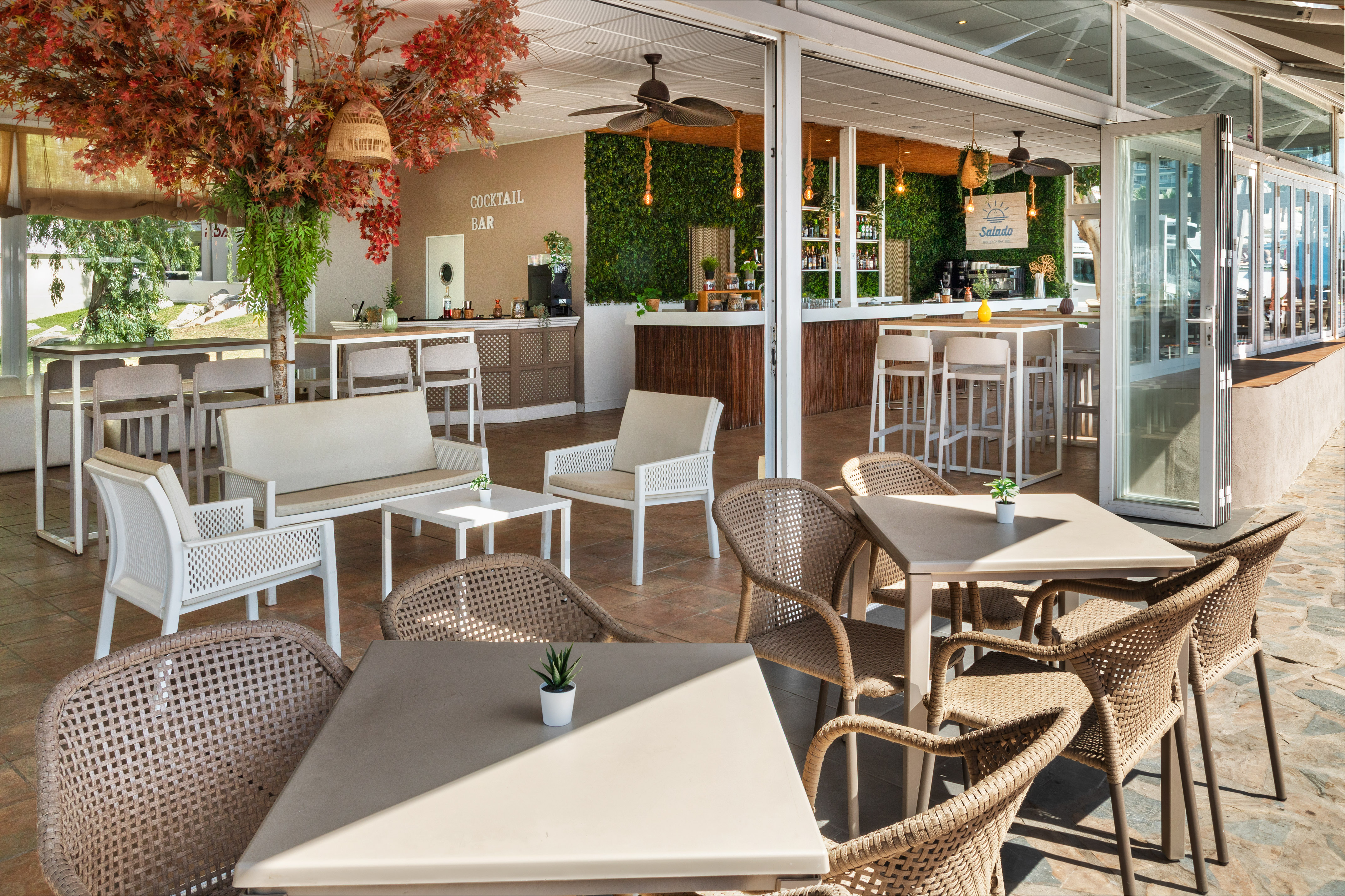 a patio with tables and chairs