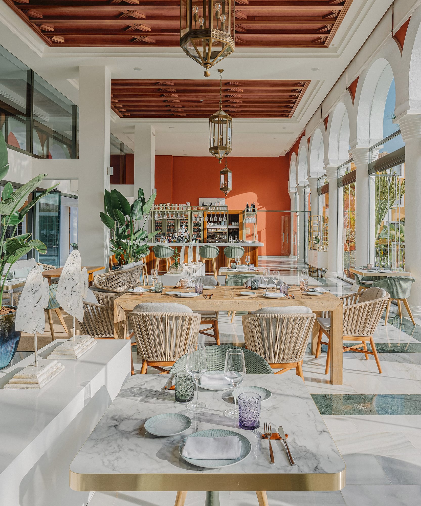 a restaurant with tables and chairs