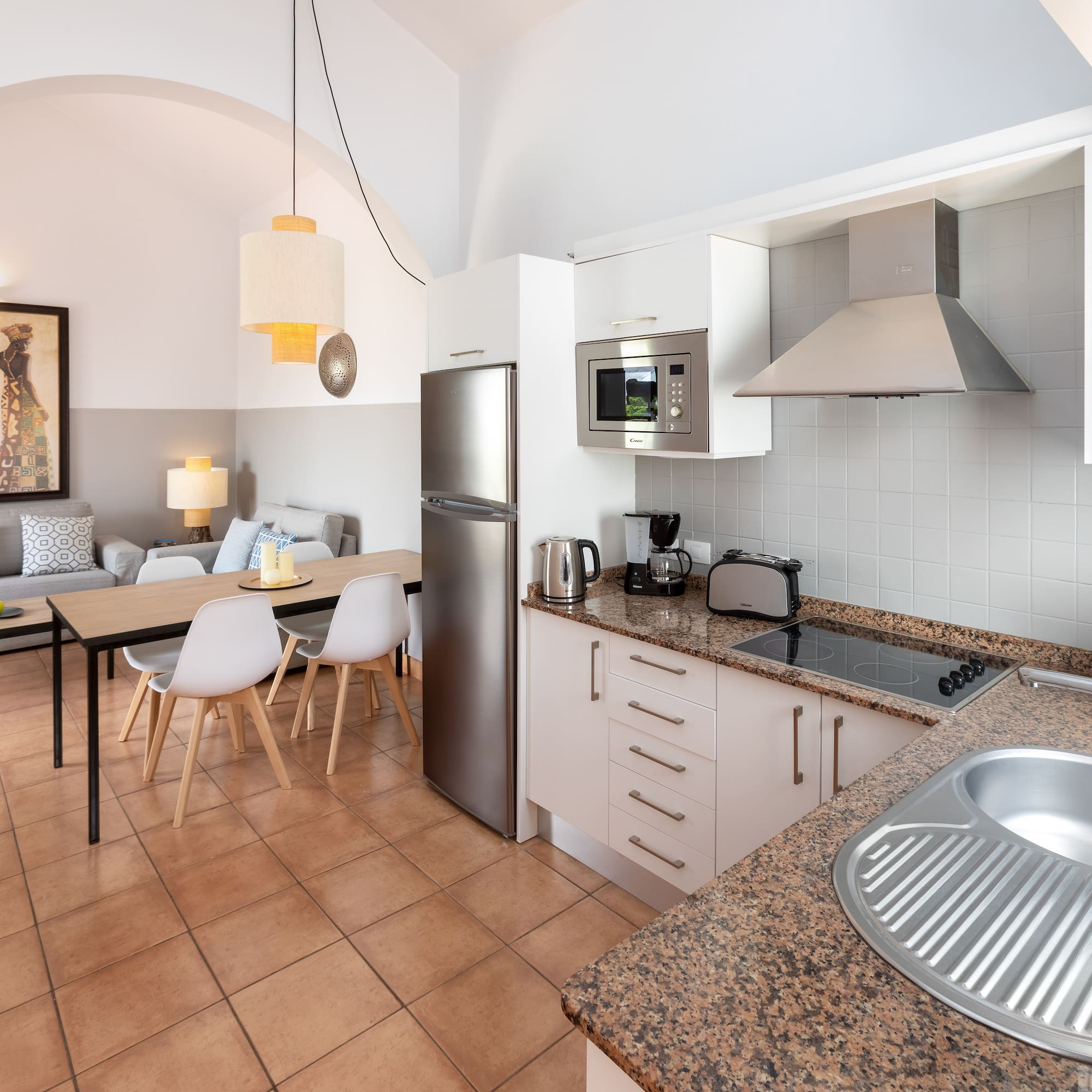 a kitchen with a table and chairs